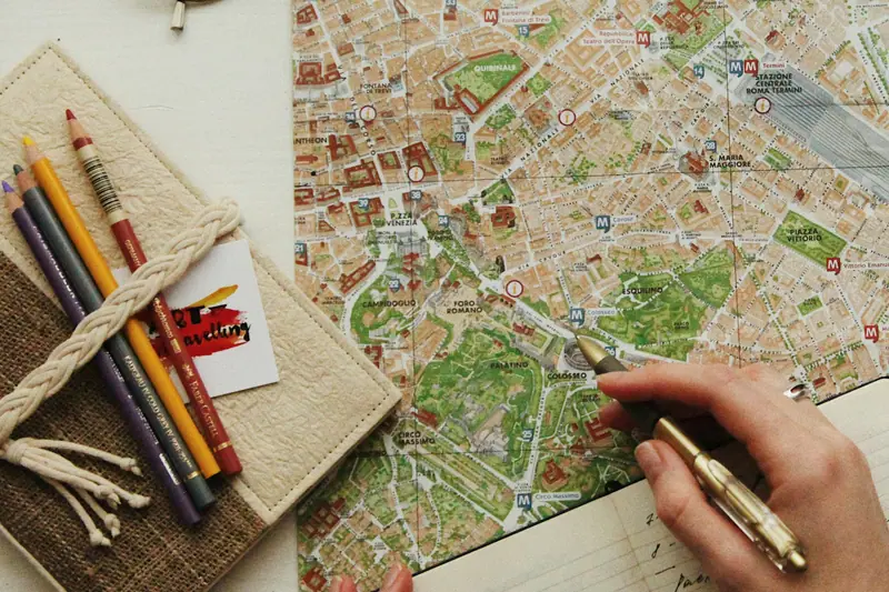Marking a travel route on a city map with a pen