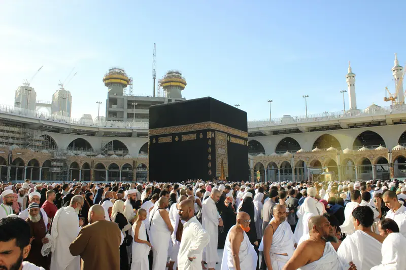 Pilgrims in ihram at the Kaaba in Masjid al-Haram, Makkah
