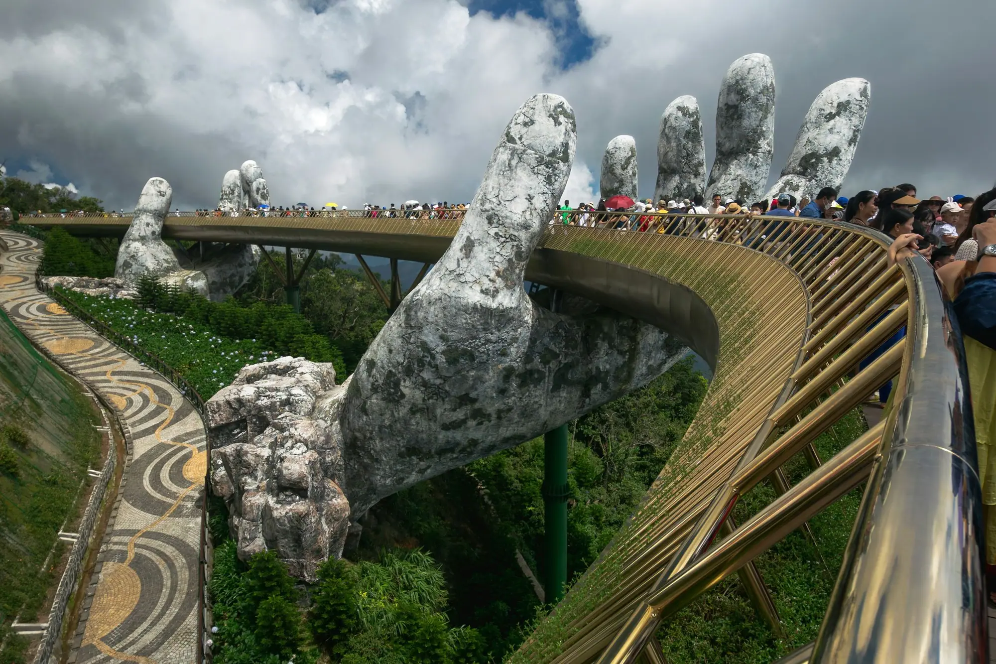 The Golden Bridge held up by two giant stone hands at Ba Na Hills, Da Nang